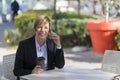 Portrait of a business woman sitting relaxed at outdoor cafe Royalty Free Stock Photo