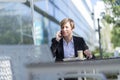 Portrait of a business woman sitting relaxed at outdoor cafe Royalty Free Stock Photo