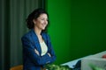 Portrait of a business woman smiling looking at the window Royalty Free Stock Photo