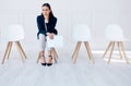 Portrait business woman waiting for an interview or stress applicant sitting alone. Sad or nervous corporate Royalty Free Stock Photo