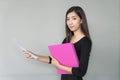 Portrait business woman holding business folder in hands. Royalty Free Stock Photo