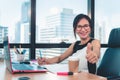 Portrait of Business Woman is Woking on Her Table Desktop in Office Workplace, Attractive Beautiful Businesswoman Smiling and Royalty Free Stock Photo