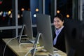 Portrait business young woman working overtime late at night in call center office Royalty Free Stock Photo