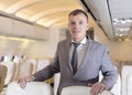 Portrait of businessman on an airplane, Passenger Relaxing Royalty Free Stock Photo