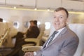 Portrait of businessman on an airplane, Passenger Relaxing Royalty Free Stock Photo