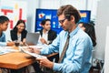 Portrait of businessman or analyst looking at camera in meeting. Meticulous