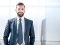 Portrait of a businessman on the background of an office window Royalty Free Stock Photo