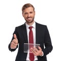 Portrait of businessman with futuristic gadget making ok sign