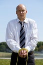 Portrait of businessman with hands tied with rope