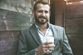 portrait of businessman having break holding coffee