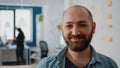 Portrait of businessman holding bottle of beer after work in office Royalty Free Stock Photo