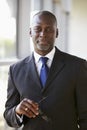 Portrait of a businessman holding glasses looking to camera Royalty Free Stock Photo