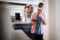 Portrait of businessman holding tablet in office and colleagues discussing in background Royalty Free Stock Photo