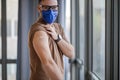 Portrait of businessman at office wearing mask got vaccinated against covid19