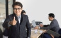 Portrait of businessman standing in front of her team at office,Asian Businessman leading her team Royalty Free Stock Photo