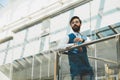 Portrait of a businessman in suit are standing on the background of glass offices. Royalty Free Stock Photo