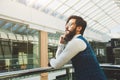 Portrait of a businessman in suit are standing on the background of glass offices. Royalty Free Stock Photo