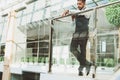 Portrait of a businessman in suit are standing on the background of glass offices. Royalty Free Stock Photo