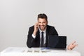 Portrait of businessman talking on mobile phone in office Royalty Free Stock Photo