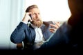 Portrait of businessman talking on mobile phone in office Royalty Free Stock Photo