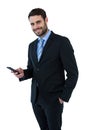 Portrait of businessman text messaging on mobile phone Royalty Free Stock Photo