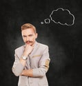 Portrait of a businessman with thinking cloud