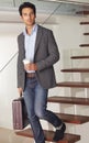 Portrait, businessman and walking on stairs for work, company or job while holding, coffee and briefcase. Greek person Royalty Free Stock Photo