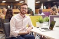 Portrait Of Businessman Wearing Headset Talking To Caller In Customer Services Centre Royalty Free Stock Photo