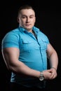 Portrait of a businessman weightlifter with large muscle in the