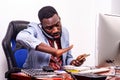 Portrait of a businessman working with telephone and computer Royalty Free Stock Photo