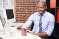 Portrait of businessman writing document at desk Royalty Free Stock Photo