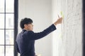 Portrait of businessmen post-it wall brick, Creative employee working in office Royalty Free Stock Photo