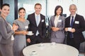 Portrait of businesspeople having tea during breaktime