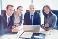 Portrait of businesspeople smiling in conference room