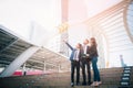 Portrait of businessteam pointing up the future on blurred city background. Business success concept Royalty Free Stock Photo