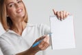 Portrait businesswoman with clipboard writing. Business concept. Royalty Free Stock Photo