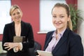 Portrait Of Young Businesswoman With Female Mentor In Office Royalty Free Stock Photo