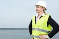 Portrait of a businesswoman in hardhat standing outdoors
