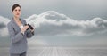 Portrait of businesswoman holding binoculars against sky Royalty Free Stock Photo