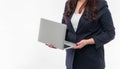 Portrait businesswoman holding silver laptop in the office isolated