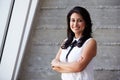 Portrait Of Businesswoman Standing Against Wall In Office Royalty Free Stock Photo