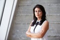 Portrait Of Businesswoman Standing Against Wall In Office Royalty Free Stock Photo