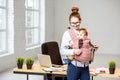 Businesswoman working with her baby son at the office Royalty Free Stock Photo