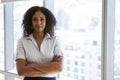 Portrait Of Businesswoman Standing By Window In Office Royalty Free Stock Photo