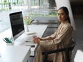 Portrait of businesswoman take a break with a cup of beverage while sitting at working table