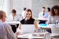 Portrait Of Businesswoman Working On Laptop In Busy Office Royalty Free Stock Photo