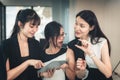 Portrait of Businesswomen Enjoying Shopping Online in Office Workplace, Asian Women Discussing Something About Credit Card While Royalty Free Stock Photo