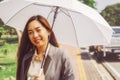 Smiling business woman with a sun protection umbrella Royalty Free Stock Photo