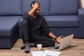 Portrait of busy worried man touching his head with hand, having headache, cant understand information given in Net, having cup Royalty Free Stock Photo