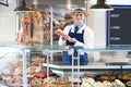 Portrait Of Butcher Standing Behind Counter Royalty Free Stock Photo